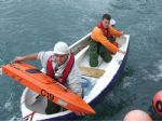 The rescue boat, seen here returning to the pits, was kept busy for most of the day.